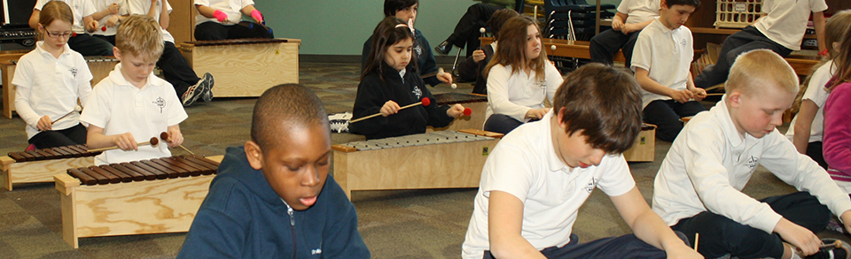 Kids playing Orff instruments